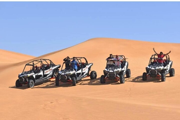 Experience the thrill of conquering Dubai's vast dunes in a 4-seater Polaris RZR X4. Unleash your adventurous spirit with self-drive exploration amidst stunning desert landscapes. Memories await in the sands!